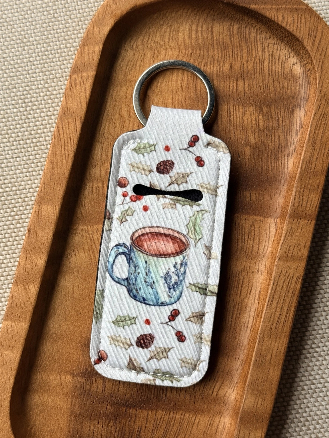 Soft neoprene chapstick holder keychain by Four Seasons of Happiness featuring assorted floral, Christmas, winter, holiday and seasonal printed designs with a durable metal keyring.