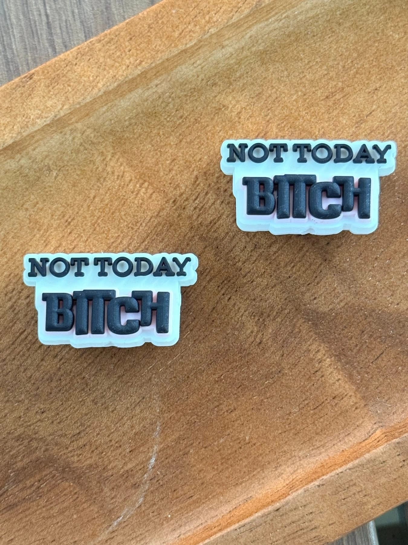Funny silicone focal bead featuring the phrase “Not Today Bitch” displayed on a wooden tray. Ideal for beadable pens, keychains, wristlets, badge reels, lanyards, and custom DIY crafting projects.