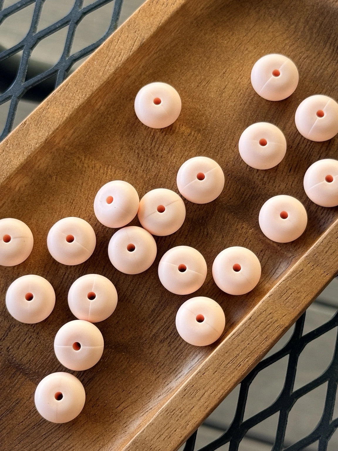 Light peach 14mm silicone abacus spacer beads with a matte finish for keychains, wristlets, badge reels, beaded pens, and DIY craft projects.