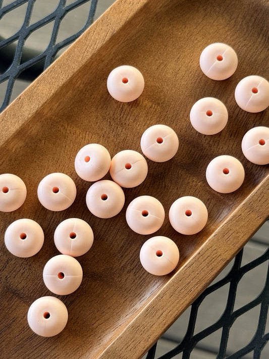 Light peach 14mm silicone abacus spacer beads with a matte finish for keychains, wristlets, badge reels, beaded pens, and DIY craft projects.