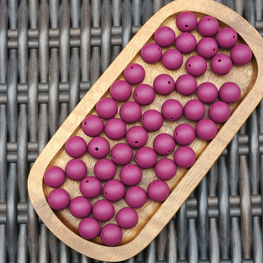 Plum Passion 15mm premium plum purple silicone round beads by Four Seasons of Happiness. BPA-free silicone craft beads available in 1, 15, 30, 60, and 120 count options for beadable pens, wristlets, keychains, badge reels, bookmarks, zipper pulls, and DIY craft projects.