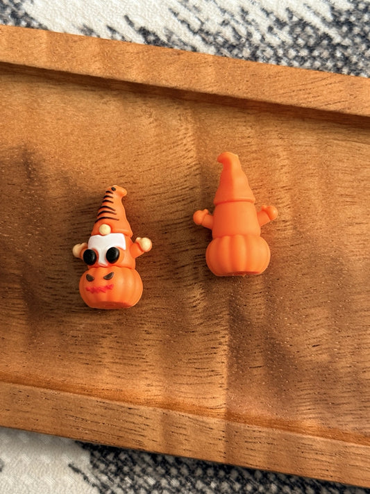 Orange 3D Halloween gnome silicone focal bead with black glasses, a white beard and pumpkin body for pens, keychains, wristlets and fall crafts.