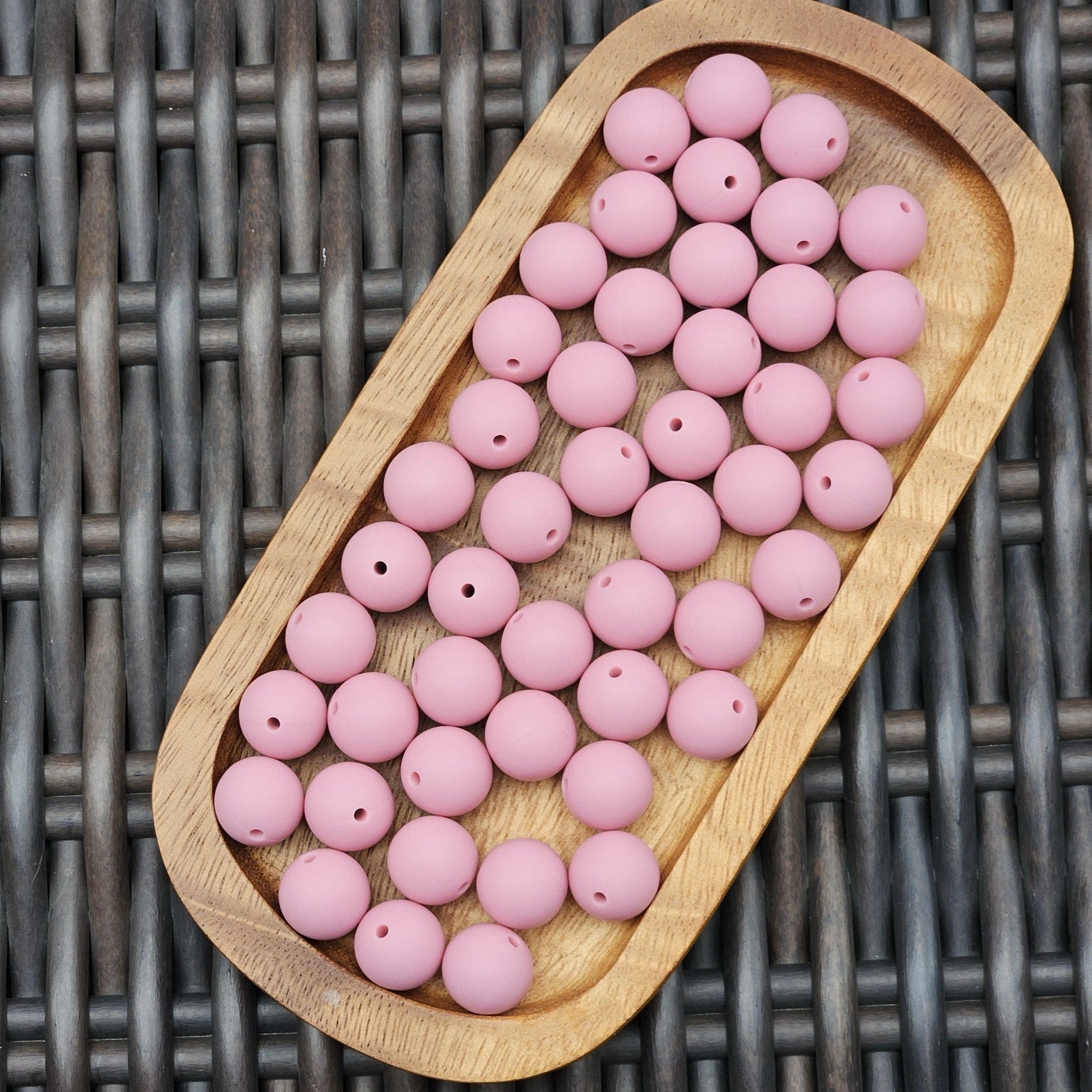 Rosy Reverie 15mm premium dusty blush silicone round beads by Four Seasons of Happiness. BPA-free silicone craft beads available in 1, 15, 30, 60, and 120 count options for beadable pens, wristlets, keychains, badge reels, bookmarks, zipper pulls, and DIY craft projects.