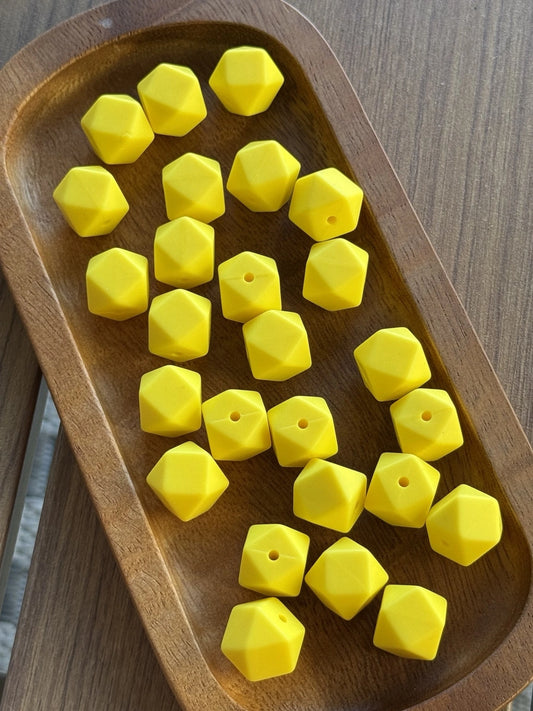 Sunshine Pop 14mm silicone hexagon beads from Four Seasons of Happiness in a vibrant yellow color. Premium food-grade silicone beads available in 5 or 10 count bags, perfect for beaded pens, keychains, badge reels, wristlets, jewelry making, and DIY craft projects.