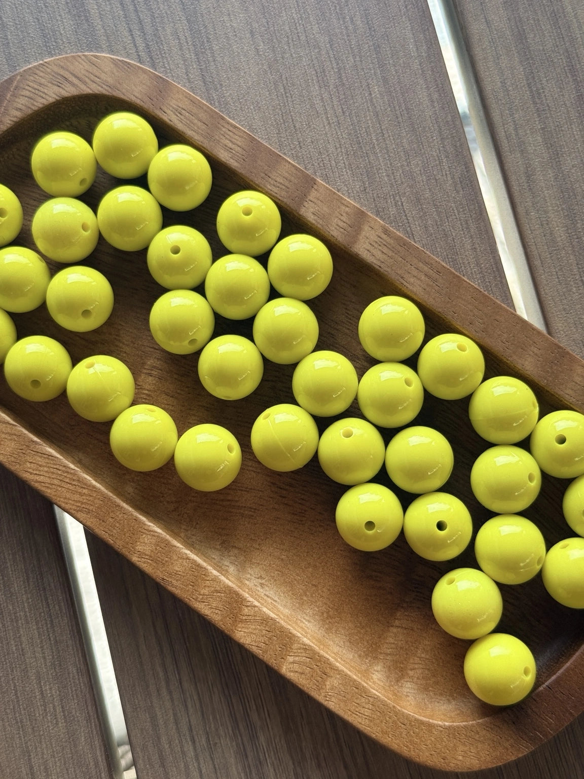 Premium 15mm Sunshine Pop Liquid silicone bead from Four Seasons of Happiness featuring a bright glossy yellow finish. Sold individually and perfect for beaded pens, keychains, wristlets, badge reels, jewelry making, and DIY craft projects.