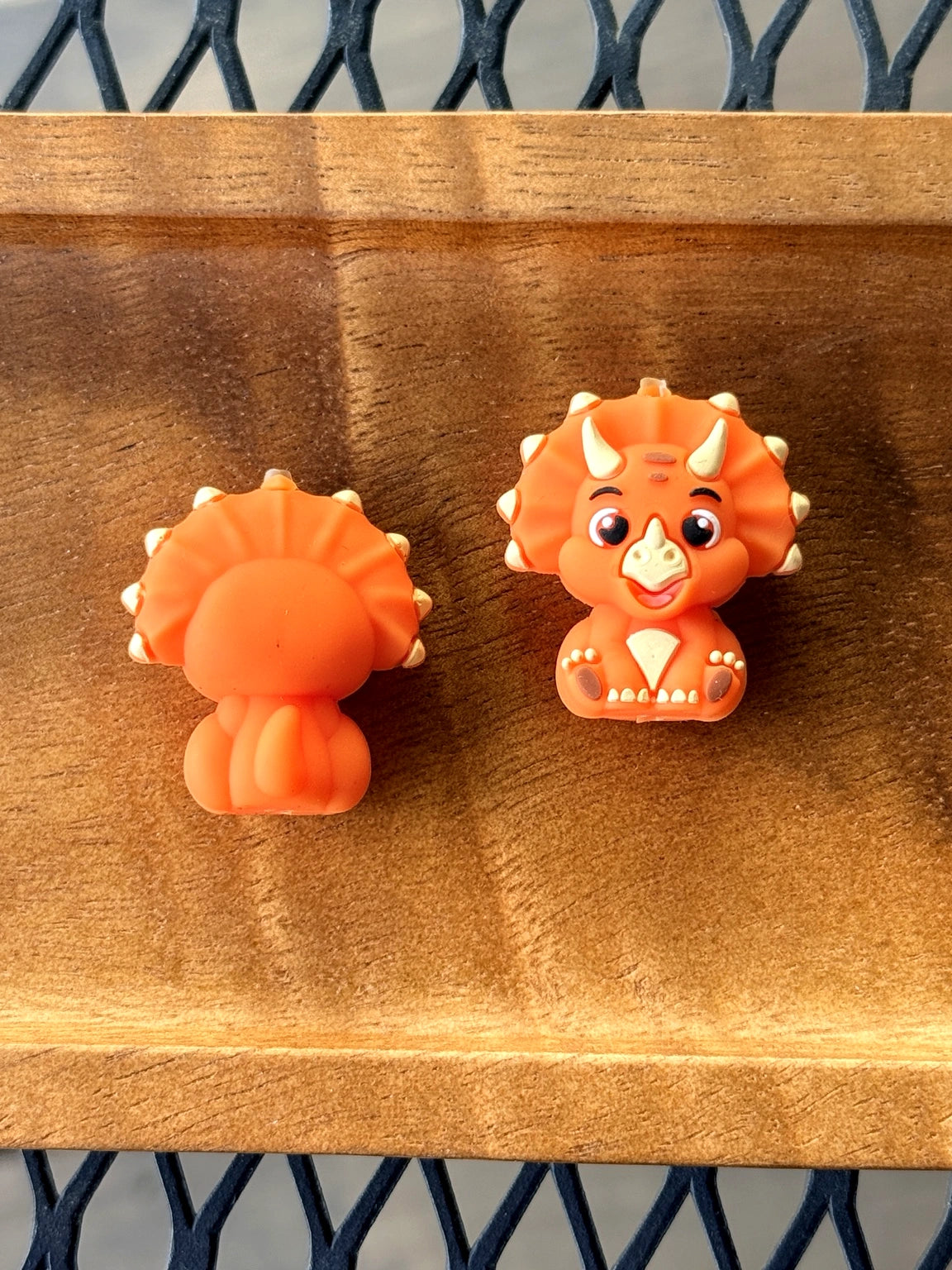 3D orange triceratops silicone focal bead for beadable pens, keychains, backpack charms, wristlets, and dinosaur DIY crafts