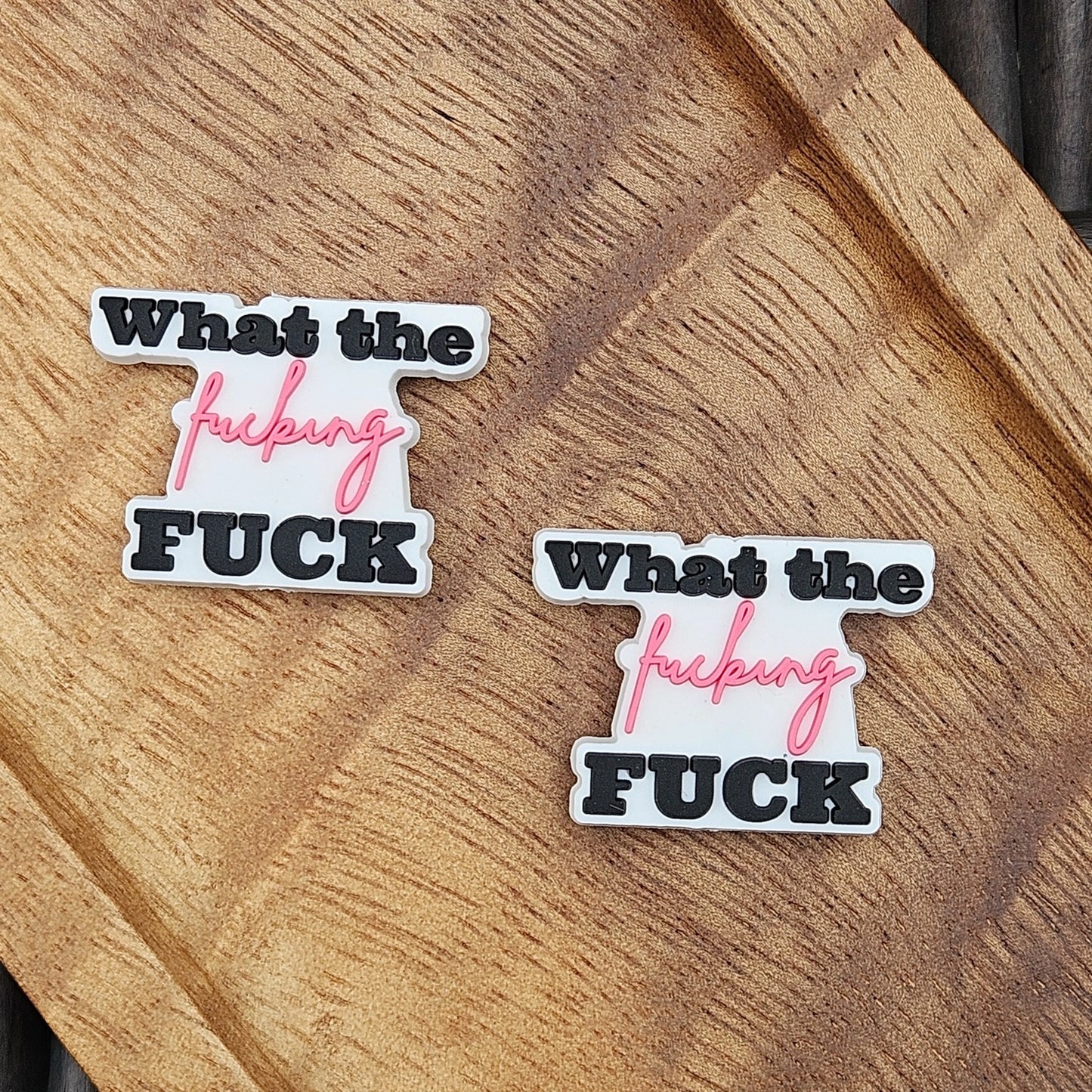 Layered silicone focal bead featuring the phrase “What the Fucking Fuck” in black and pink lettering. Perfect for beadable pens, keychains, wristlets, badge reels, bookmarks, zipper pulls, lanyards, and DIY craft projects from Four Seasons of Happiness.