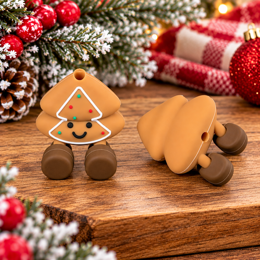 Cute gingerbread Christmas tree silicone focal bead featuring white icing trim, red and green sprinkles, smiling face, and brown boots for holiday DIY crafts.