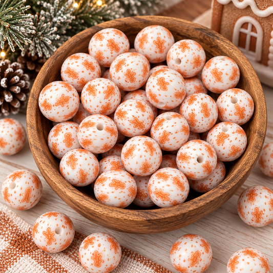 Gingerbread Giggles & Sugar Sprinkles 15mm printed silicone beads featuring orange gingerbread cookie figures and sprinkle dots on a creamy white background, sold individually.