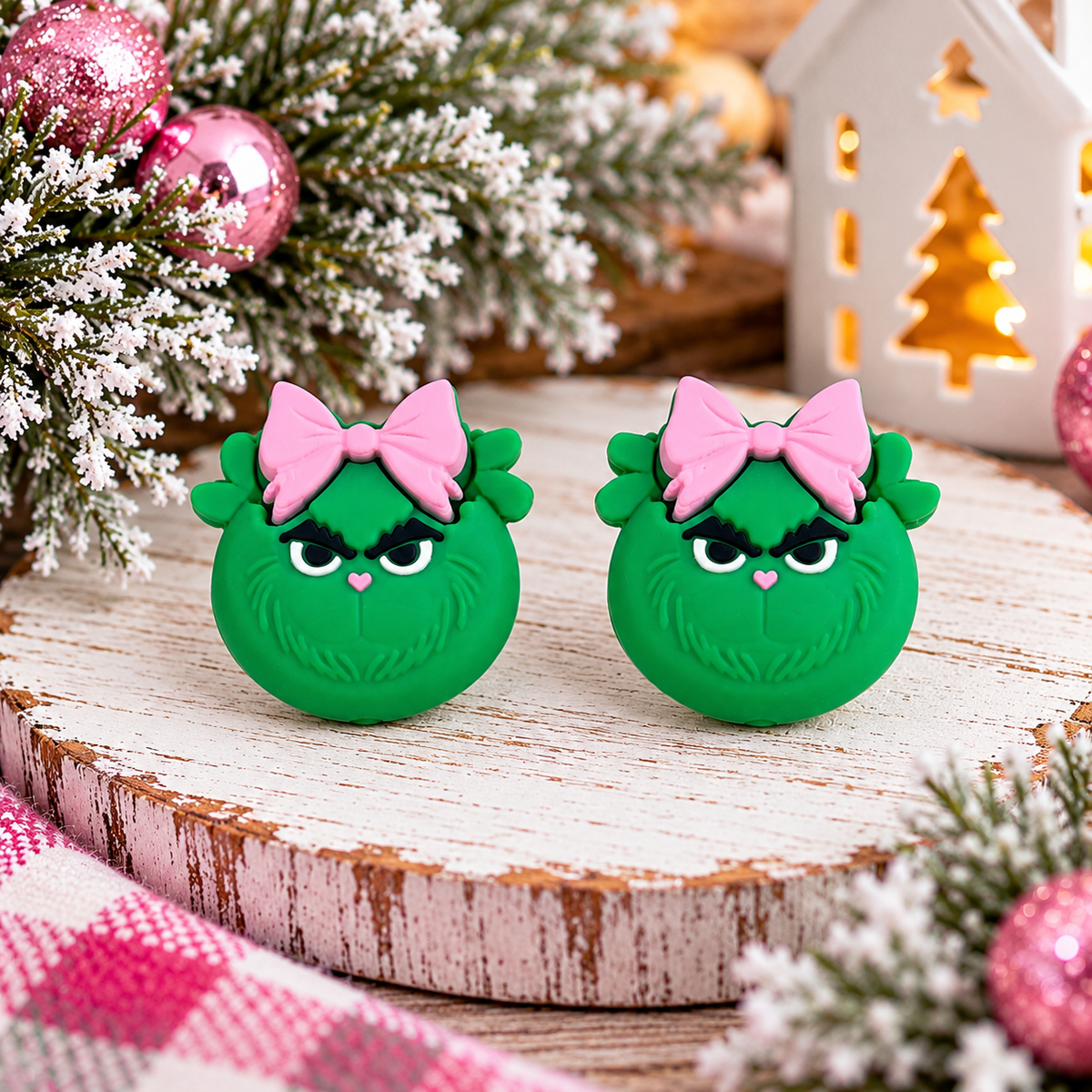 Green grumpy Christmas silicone focal bead with pink bow and heart-shaped nose for holiday crafting