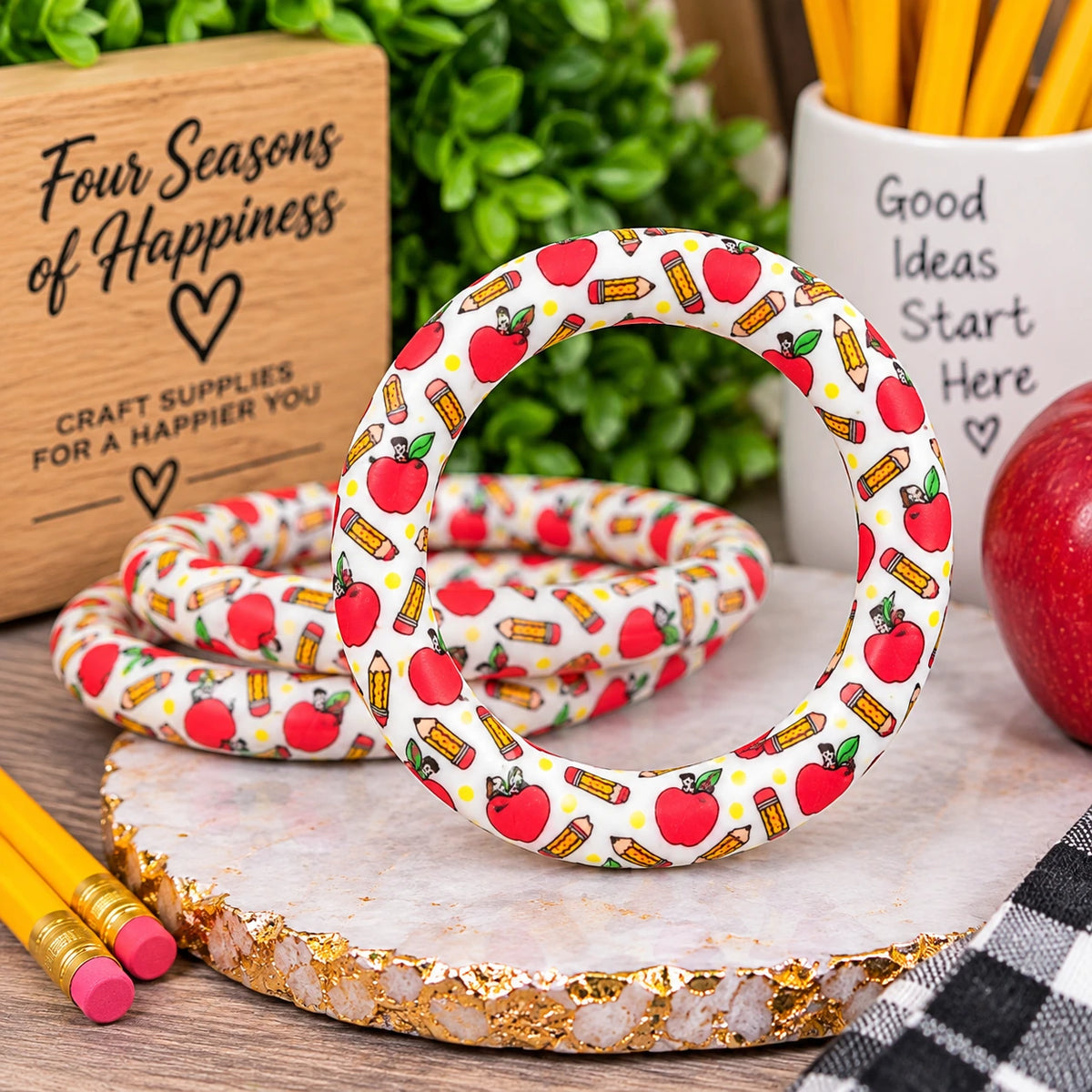 Happy Little Lessons 65mm printed silicone ring bead featuring red apples and yellow pencils on a white background, sold individually by Four Seasons of Happiness.