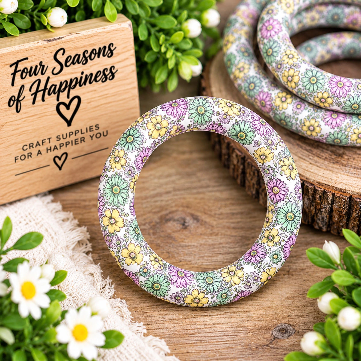 Meadow Daydream 65mm printed silicone ring bead featuring pastel mint green, soft purple and yellow flowers on a white background, sold individually by FSOH.