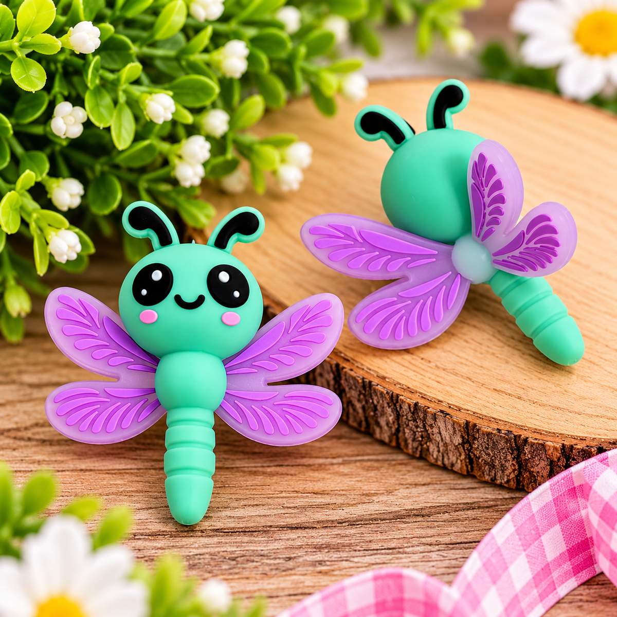 Cute mint green dragonfly silicone focal bead with lavender purple wings, black eyes and pink cheeks for DIY beaded pens, keychains and wristlets.