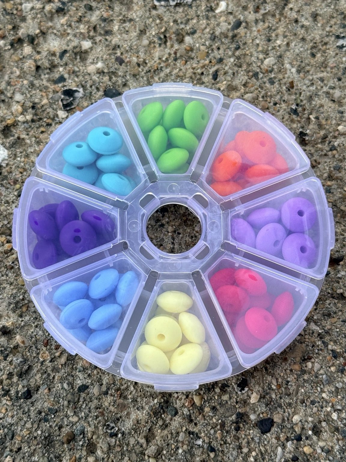 Neon Dreams silicone lentil spacer bead box featuring 80 colorful silicone spacer beads in 8 vibrant colors with reusable storage organizer.