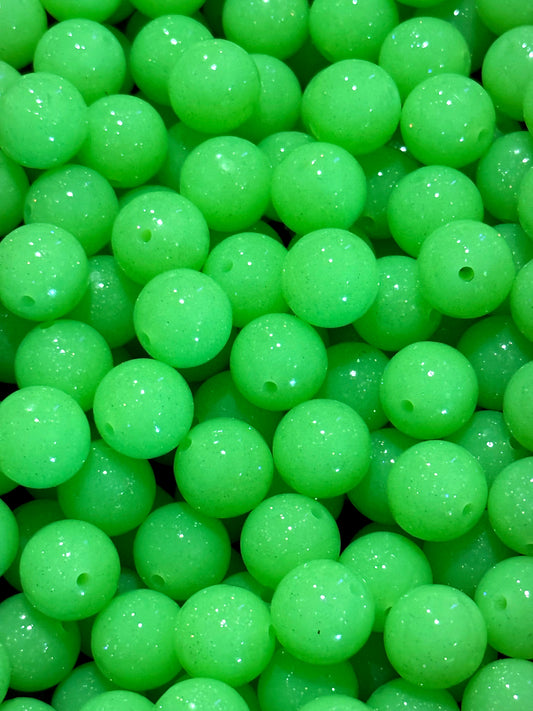 Close-up of green beads with a glossy finish