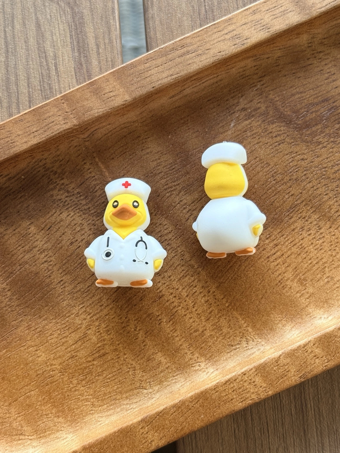 Yellow nurse duck silicone focal bead wearing a white nurse uniform and nurse cap. Perfect for beadable pens, badge reels, keychains, wristlets, and healthcare-themed craft projects.