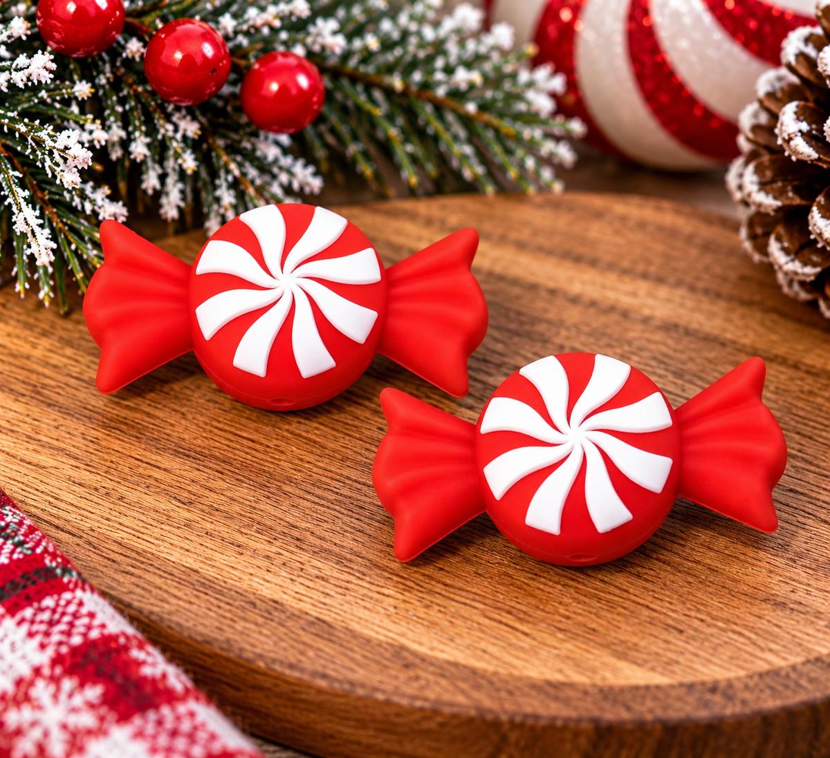Peppermint Wishes & Candy Kisses Christmas silicone focal bead featuring a red wrapped peppermint candy with a white swirl design, perfect for DIY wristlets and keychains, sold individually.