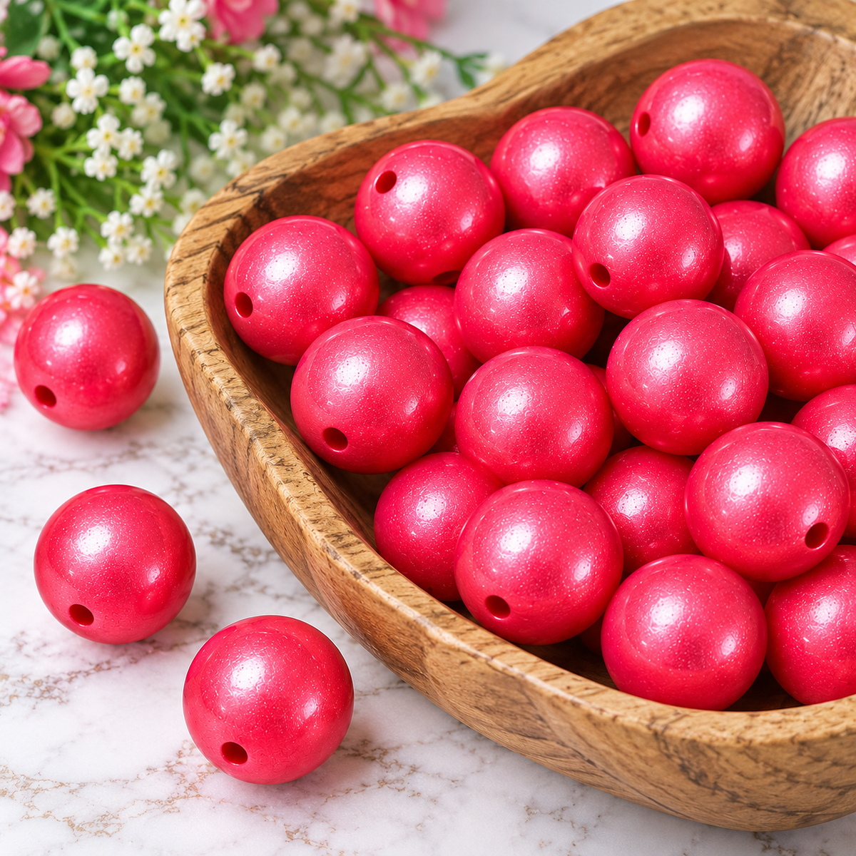 Pink Radiance metallic silicone round beads displayed in a rustic wooden bowl with a bright pink shimmering finish