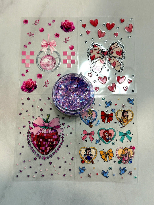 Princess themed UVDTF cup wrap bundle with bows, hearts and matching chunky fine glitter mix for DIY snow globe tumblers from Four Seasons of Happiness.