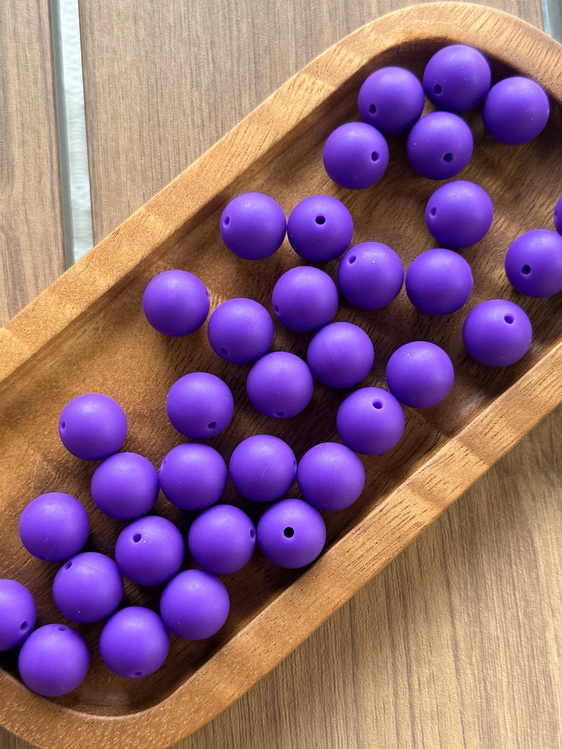 Deep purple 15mm matte silicone round beads displayed in a wooden tray for crafting, beadable pens, jewelry making, wristlets, and DIY accessories