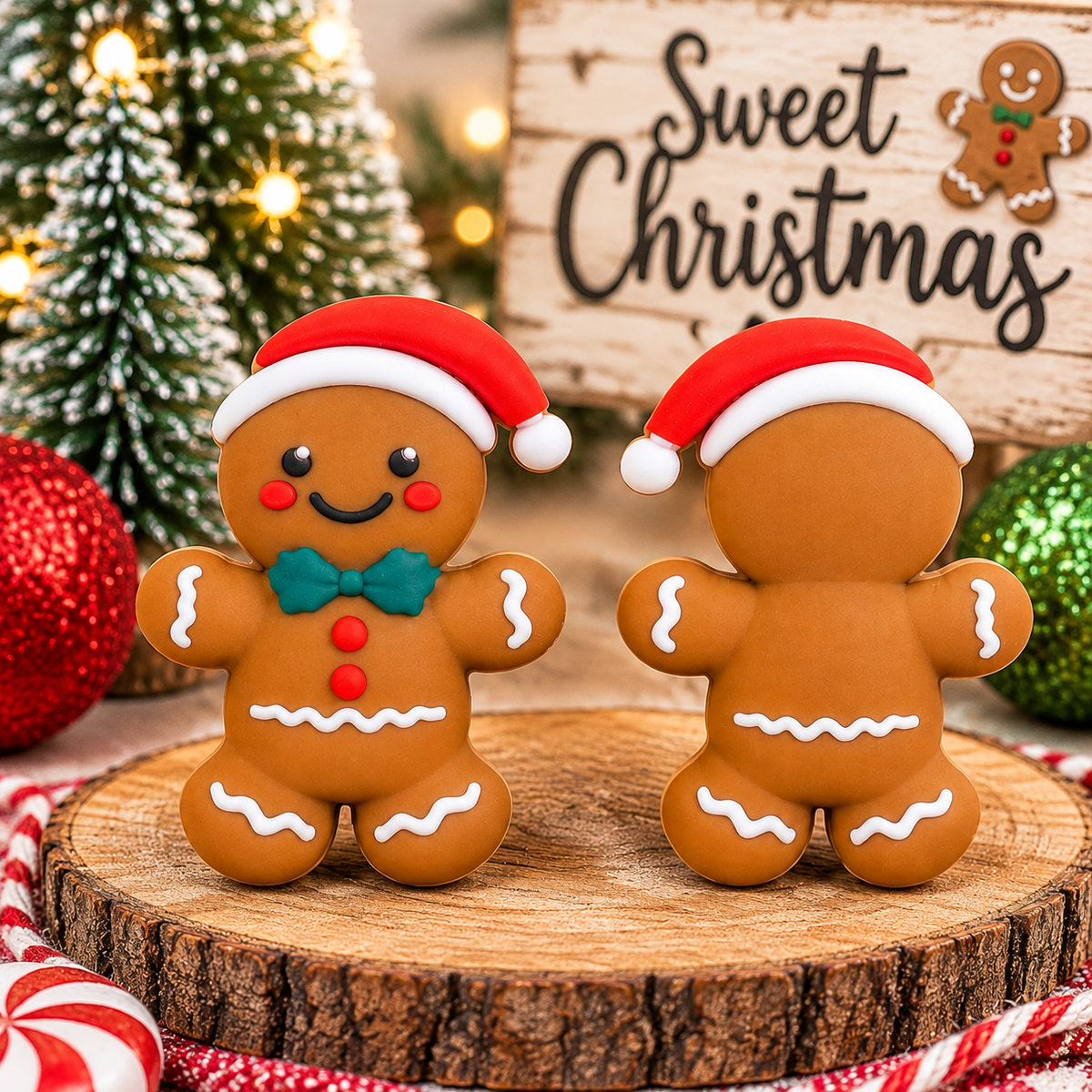 Sir Ginger Snickerdoodle Christmas gingerbread man silicone focal bead featuring a red Santa hat, teal bow tie, red buttons, rosy cheeks, and white icing details, sold individually.
