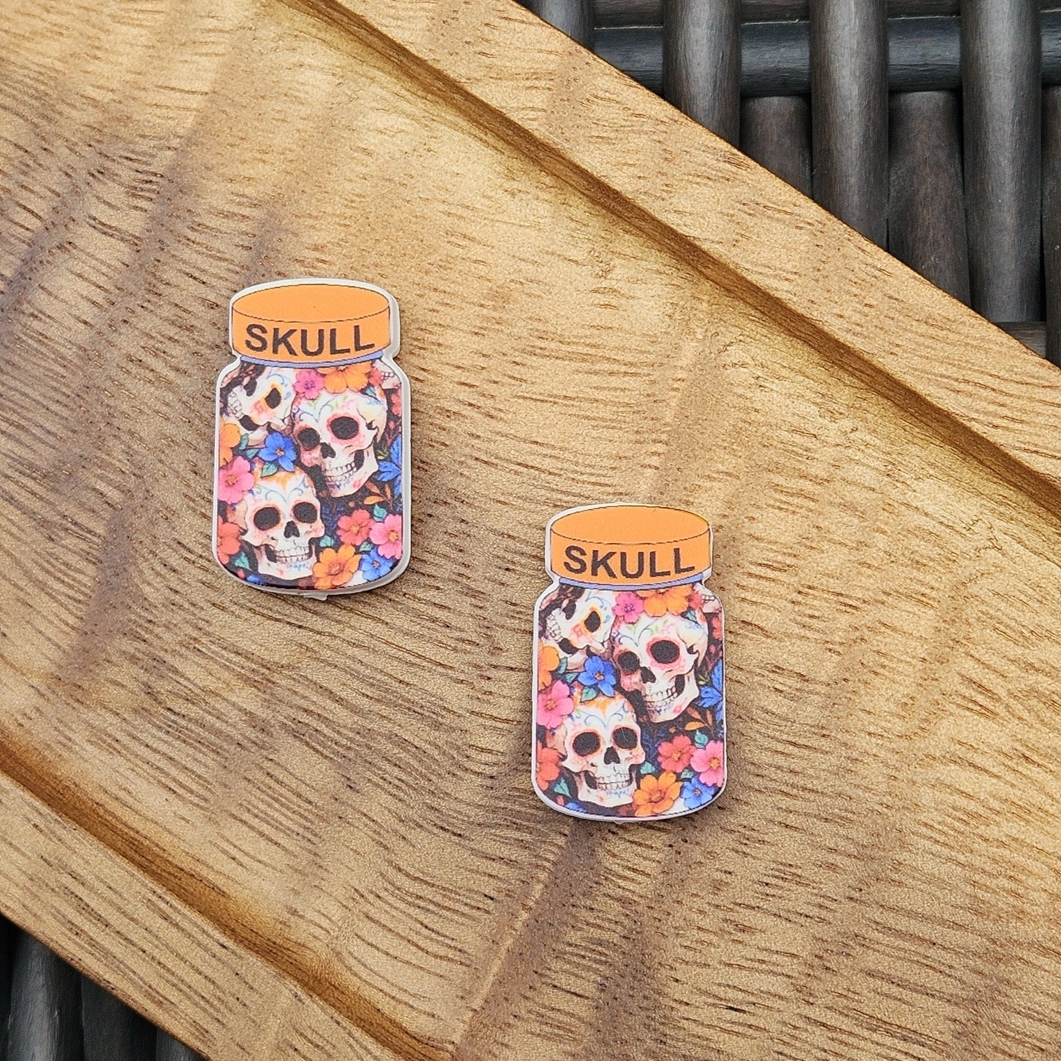 Colorful Skull Jar silicone focal bead featuring floral sugar skull artwork. Premium silicone craft bead for Halloween pens, keychains, wristlets, badge reels and DIY projects.