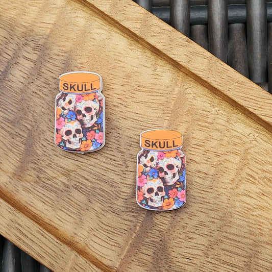 Colorful Skull Jar silicone focal bead featuring floral sugar skull artwork. Premium silicone craft bead for Halloween pens, keychains, wristlets, badge reels and DIY projects.