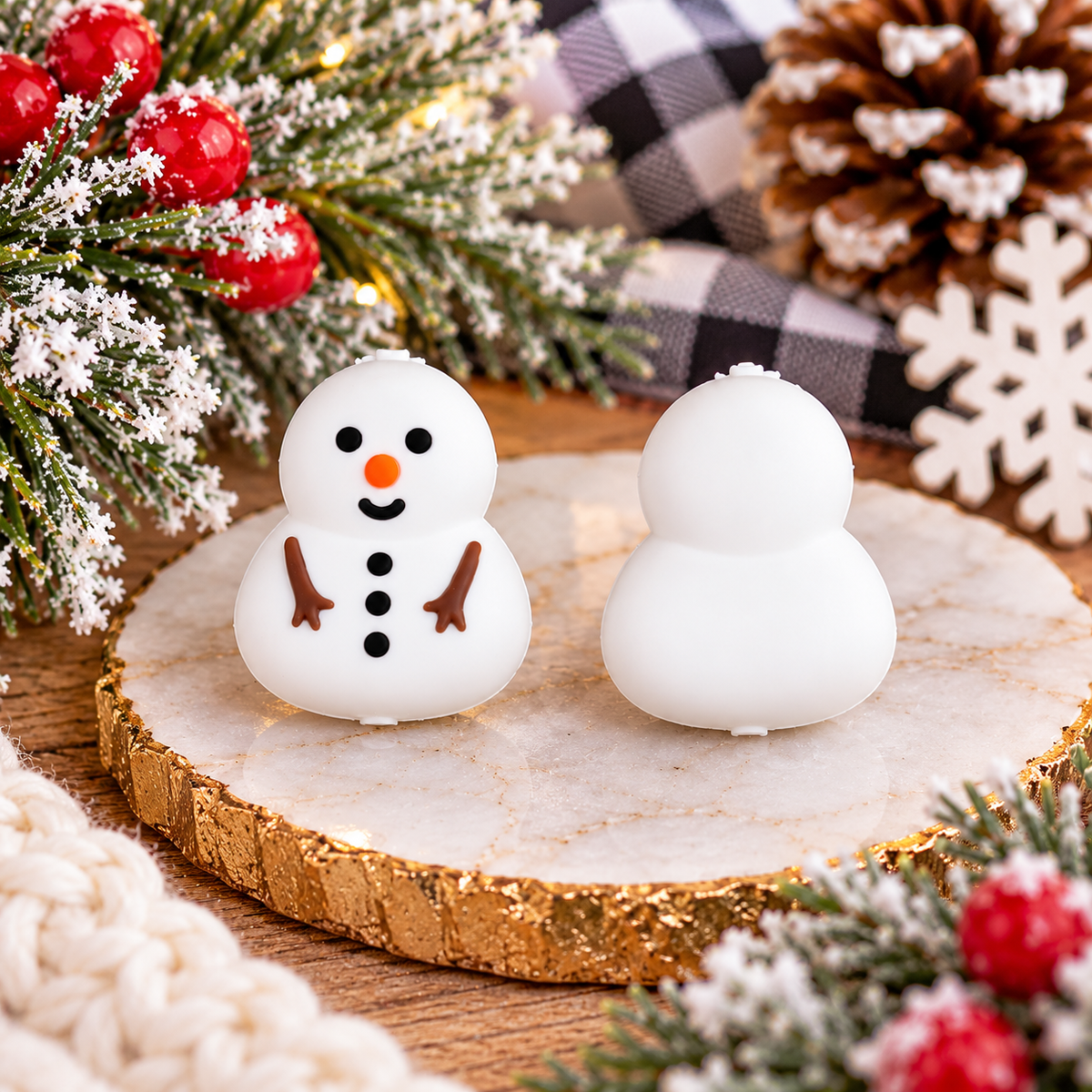 White snowman silicone focal bead with orange carrot nose, black buttons and brown twig arms for Christmas crafting