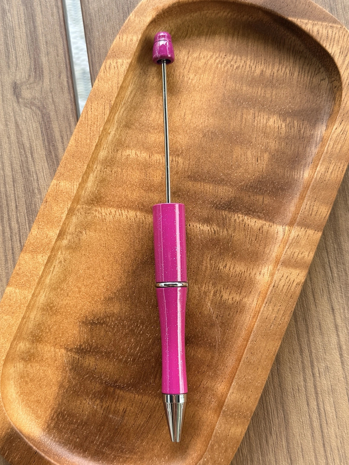 Starlight Berry glitter beadable pen featuring a vibrant berry pink glitter finish with refillable black ink and beadable pen hardware.