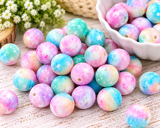 Starlight Wishes 15mm printed silicone beads featuring pastel pink, blue, mint and lavender galaxy colors with star designs.