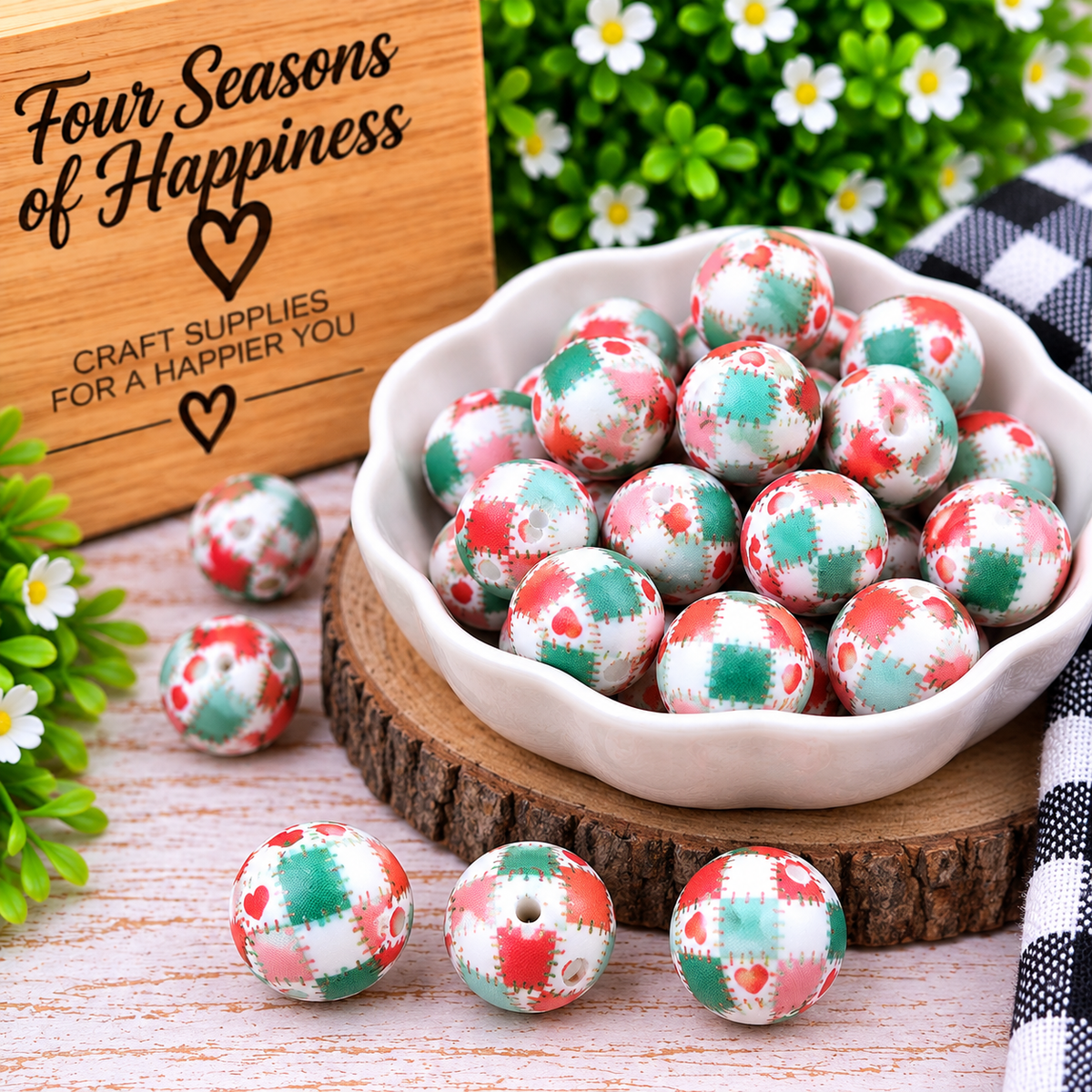 Stitched with Love 15mm printed silicone bead featuring pink, coral, mint, green and white patchwork with small heart details.