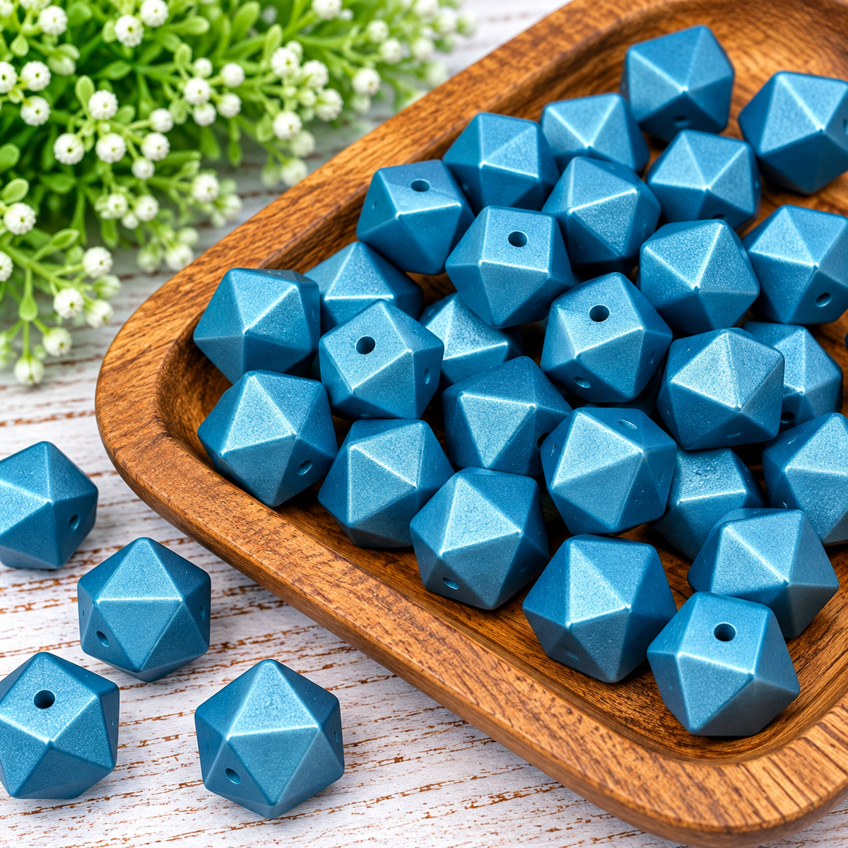 Twilight Treasure metallic blue 14mm silicone hexagon beads displayed in a wooden tray, sold in 10-count bags