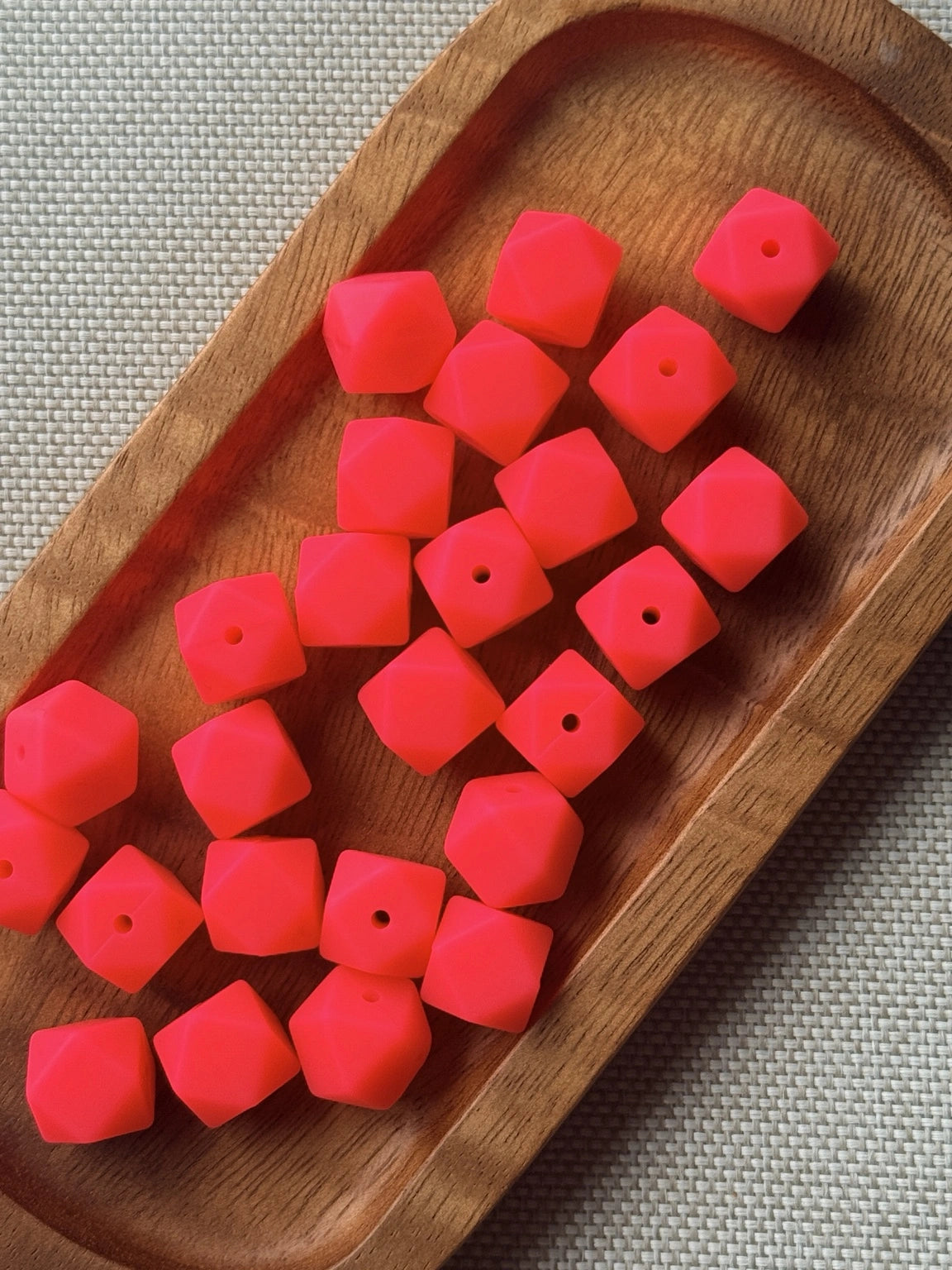 Watermelon Splash 14mm bright red-pink silicone hexagon beads with a faceted geometric shape, available in 5 or 10 count bags for DIY crafts.