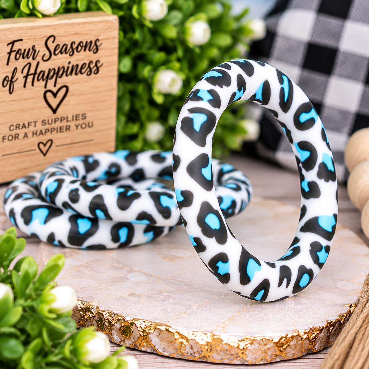 Wild at Heart 65mm silicone ring bead featuring a turquoise, black and white leopard print, sold individually by Four Seasons of Happiness.